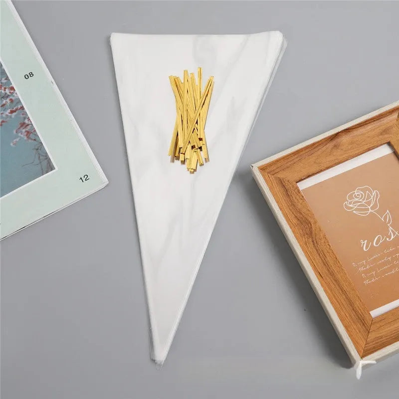 Clear triangular plastic packaging bag with a white tie wire closure, shown in three different sizes.