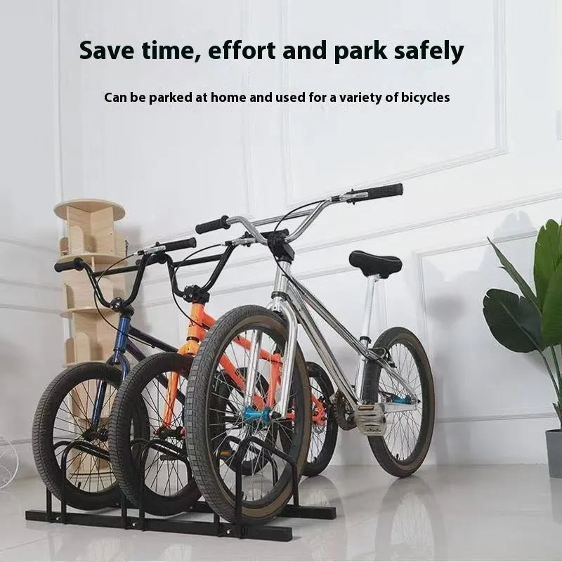 Black metal bicycle parking rack with four card positions holding bicycles upright