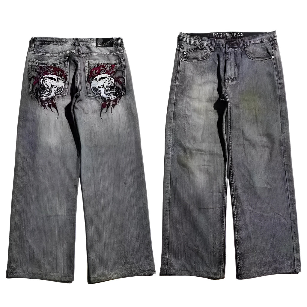 Grey washed-out denim jeans on a man, showing wide-leg straight cut and mid-waist fit.