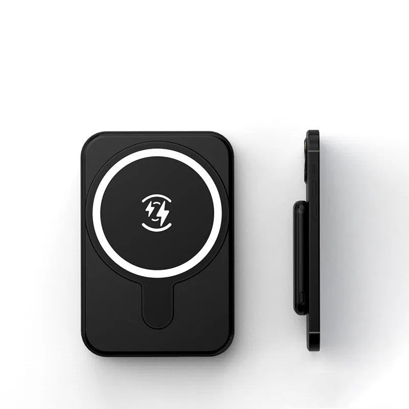Mini magnetic wireless power bank 5000mAh with LED display and AI cooling in cool black colour on a table