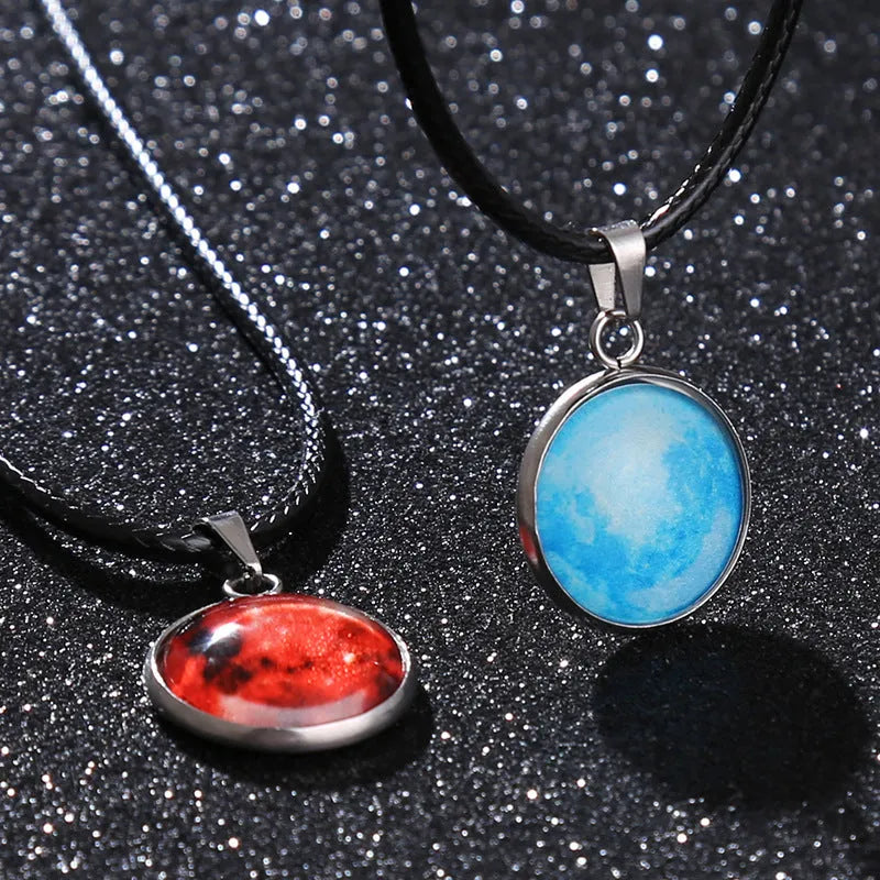 Luminous moon and constellation night sky pendant on an extendable alloy necklace chain.