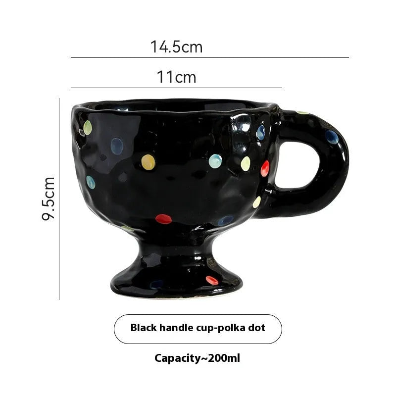 Hand-pinched irregular ceramic mug in a solid colour, shown from the side.