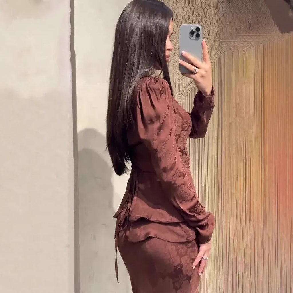 Dark brown long sleeve floral dress with button details and a fake two-piece retro design.