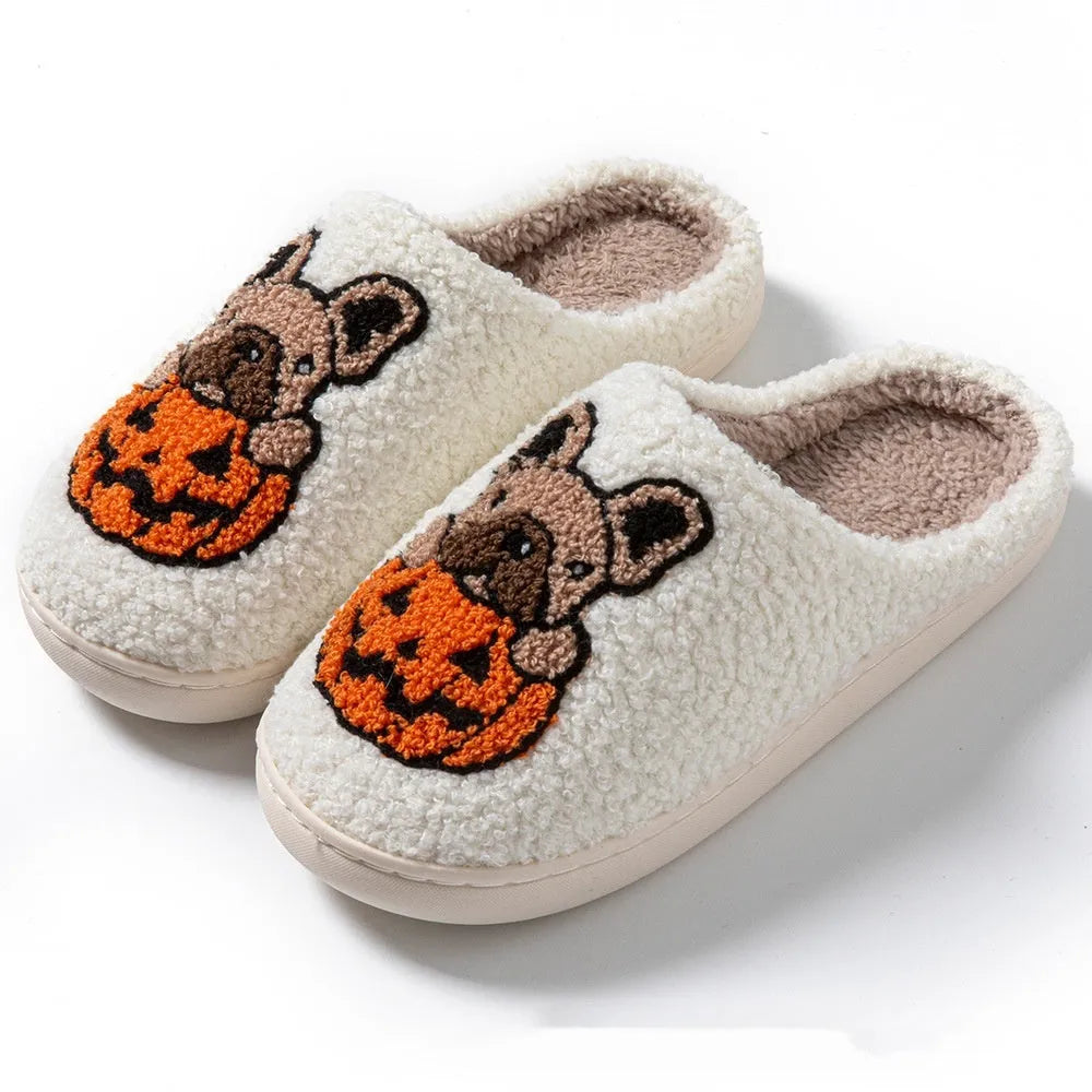 Black and white Halloween pumpkin plush slippers with round toe design and TPR rubber soles
