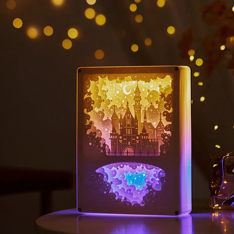 Three-dimensional paper carving USB night light with remote control on bedside table