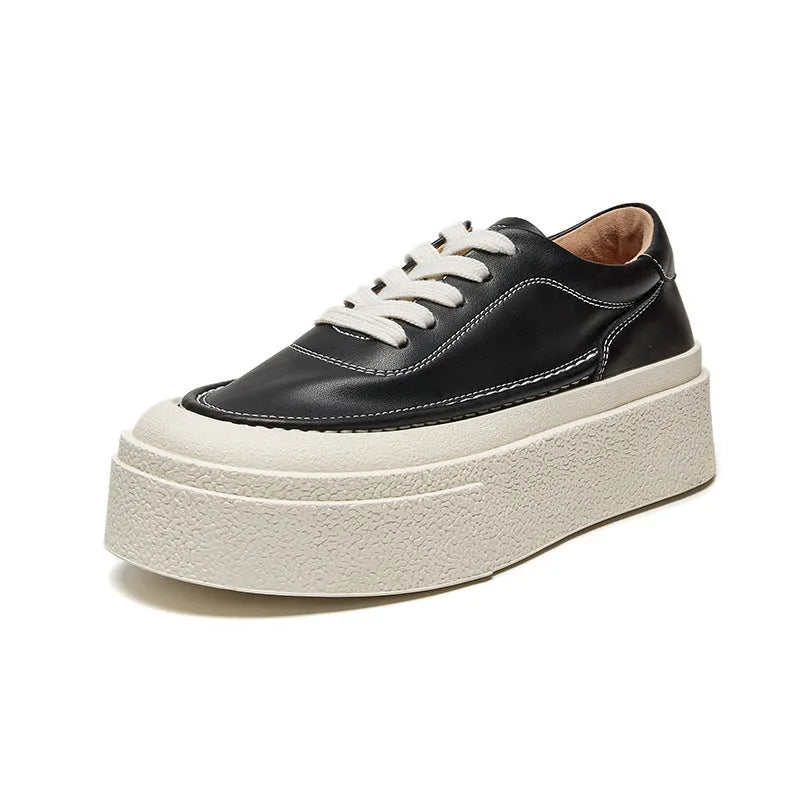 Women's black platform casual sports shoes with embossed cowhide leather upper and round toe design