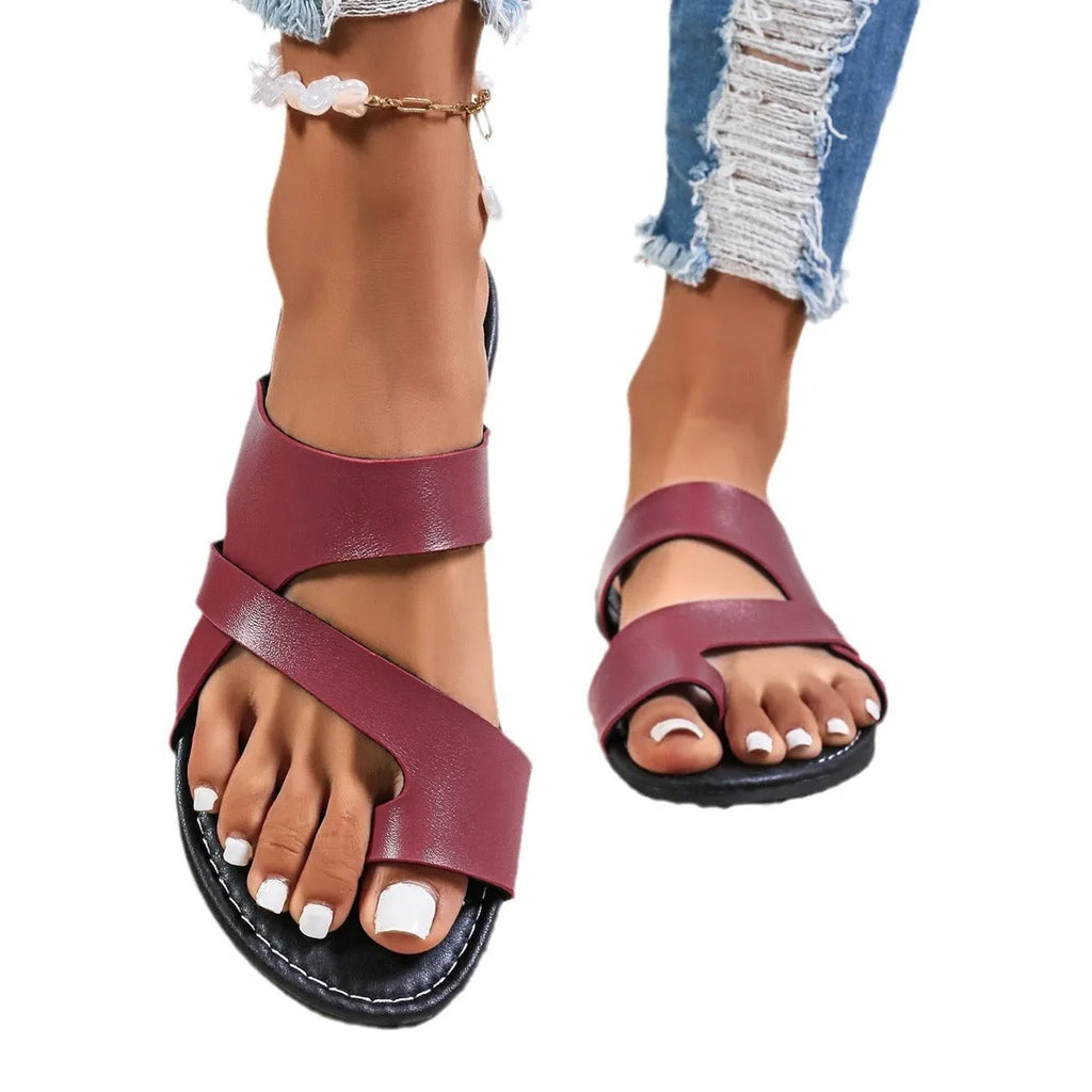 Round toe casual beach slippers with hollow out design on artificial PU upper.