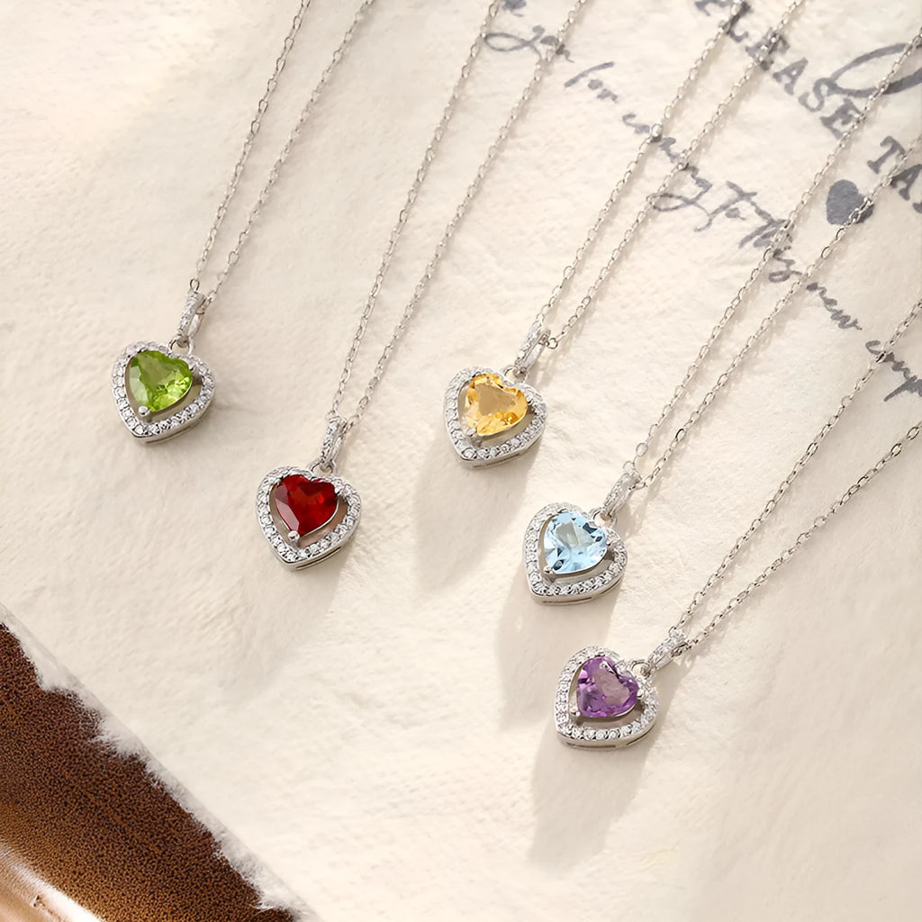 Sterling silver heart pendant necklace with natural coloured gemstone on adjustable cross chain