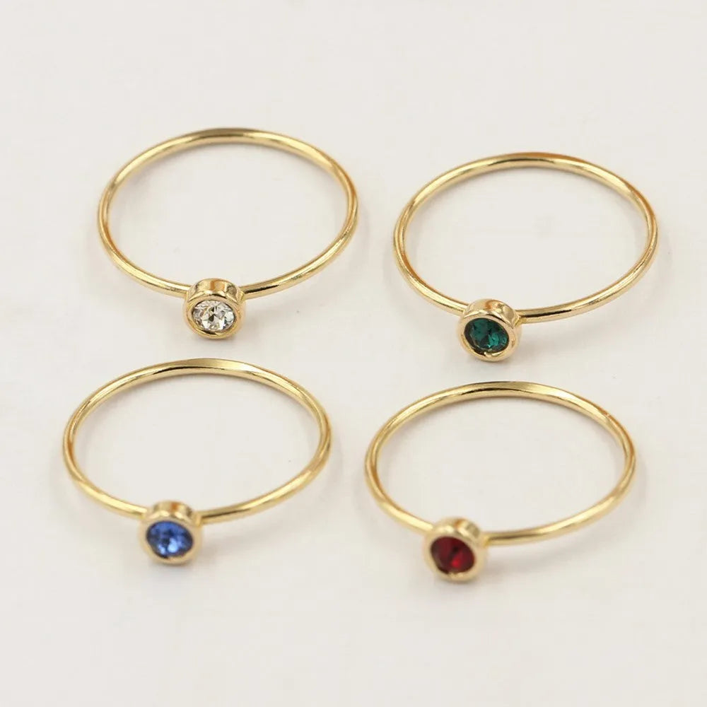 14K gold gilded brass knuckle ring with zircon stones in green blue dark red white colours