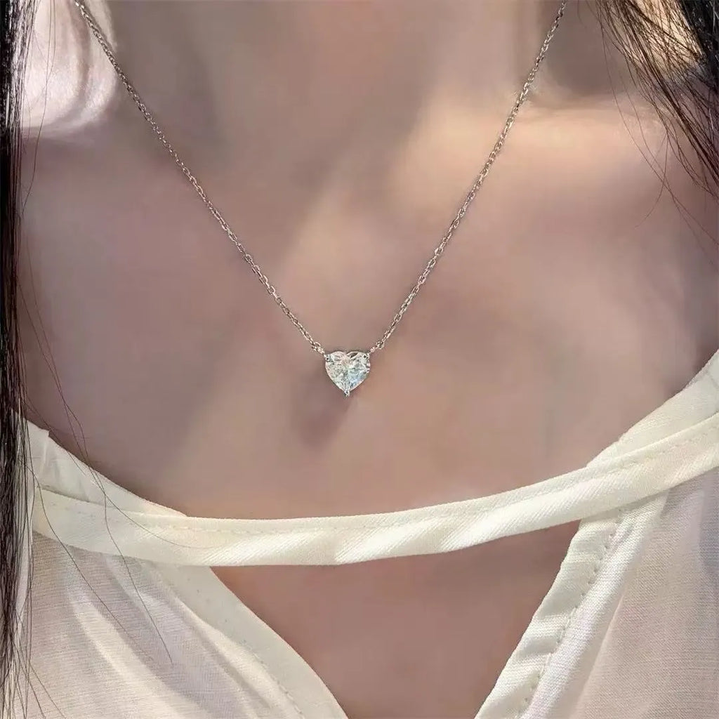Women's silver heart necklace with minimalist refined grace design on copper pendant