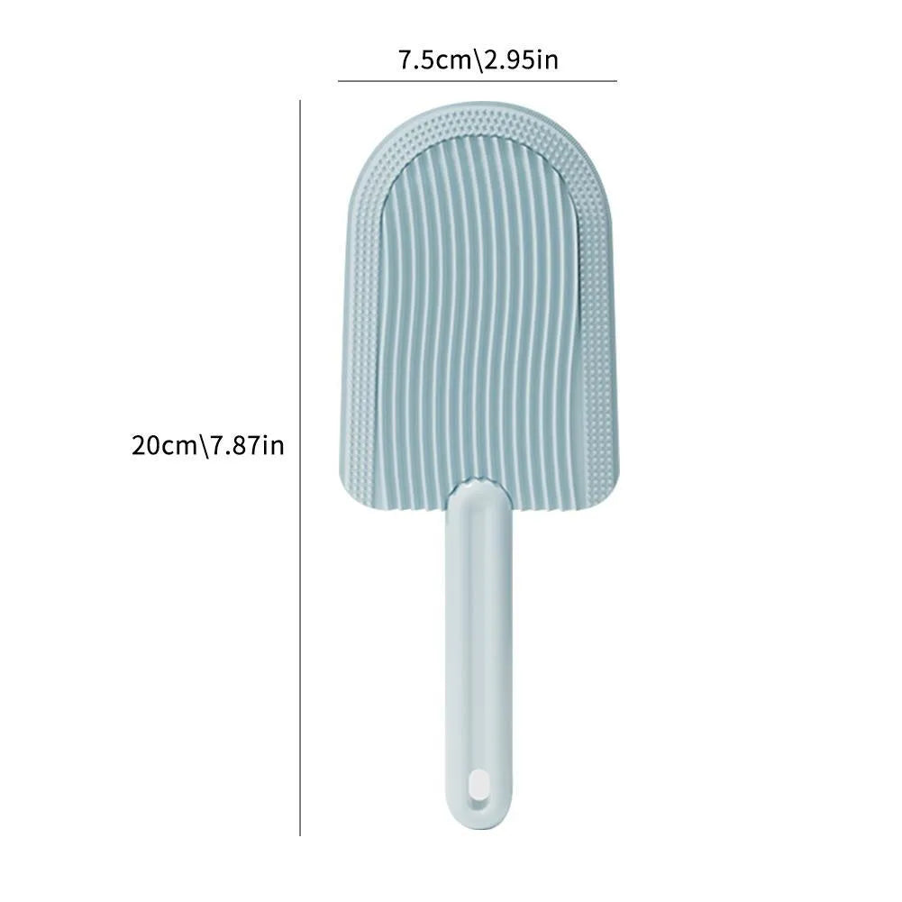 Soft silicone foldable pet hair brush in green, blue and yellow, used for grooming cats and dogs