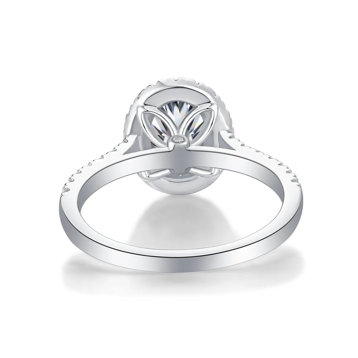 Egg-shaped 7x9mm moissanite wedding ring in S925 silver with platinum plating on white background