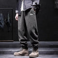 Men's grey ankle-tied straight leg casual sweatpants laid flat