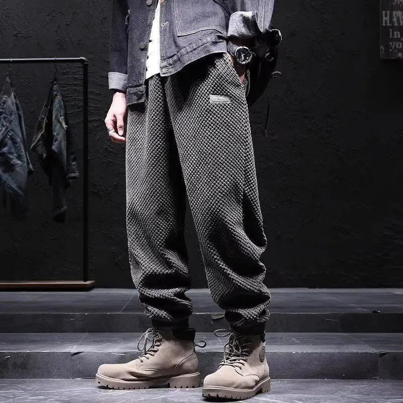 Men's grey ankle-tied straight leg casual sweatpants laid flat