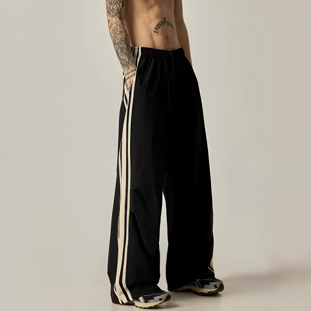 Black men's wide leg climbing trousers with high waist and straight leg design.