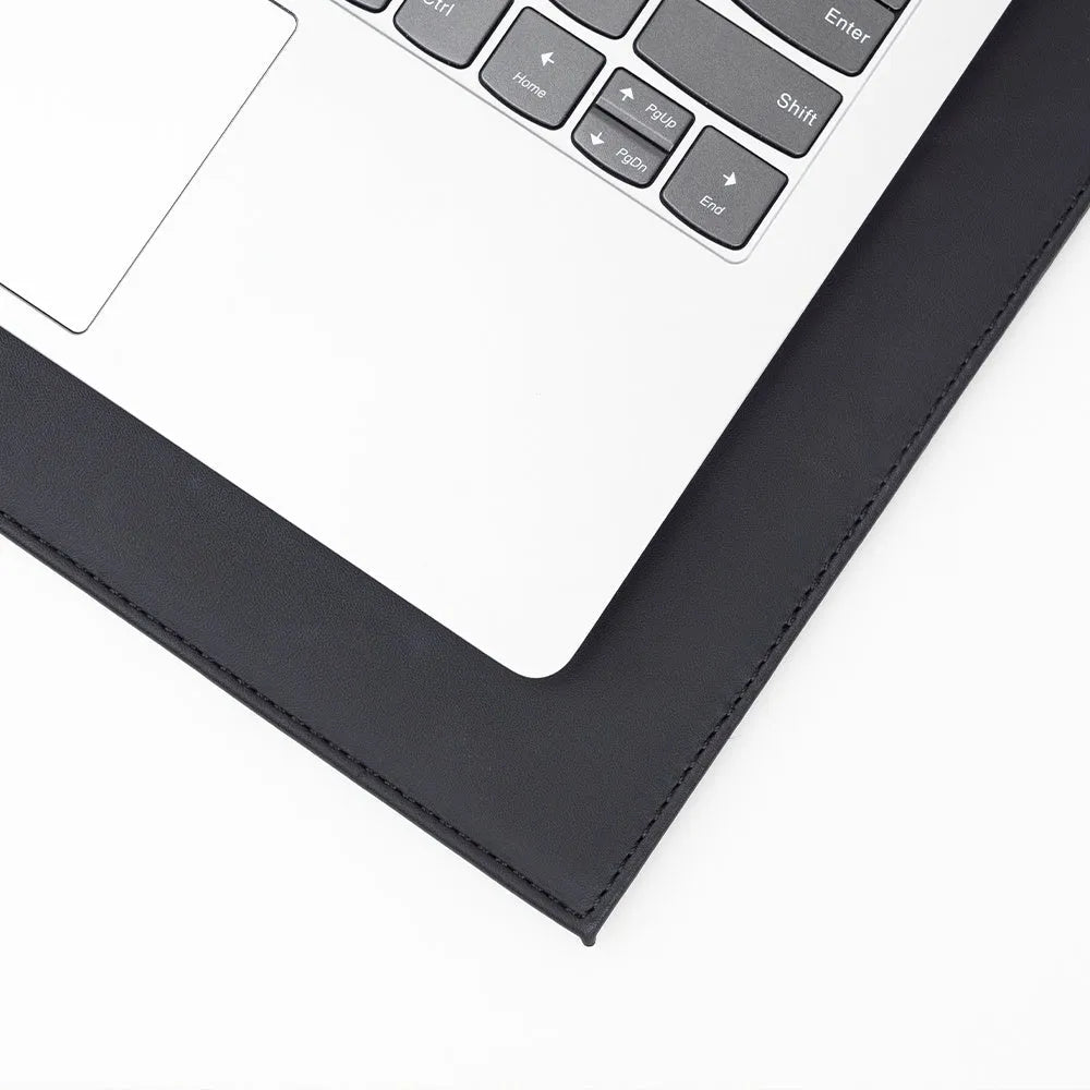 A4 anti-radiation laptop cooling pad with waterproof PU leather cover in various colours on a desk.