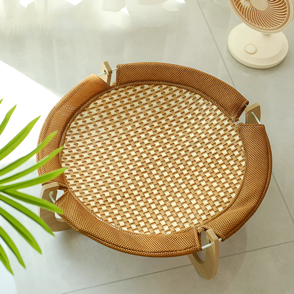 Brown woven rattan pet hammock bed for cats and small dogs on elevated stand