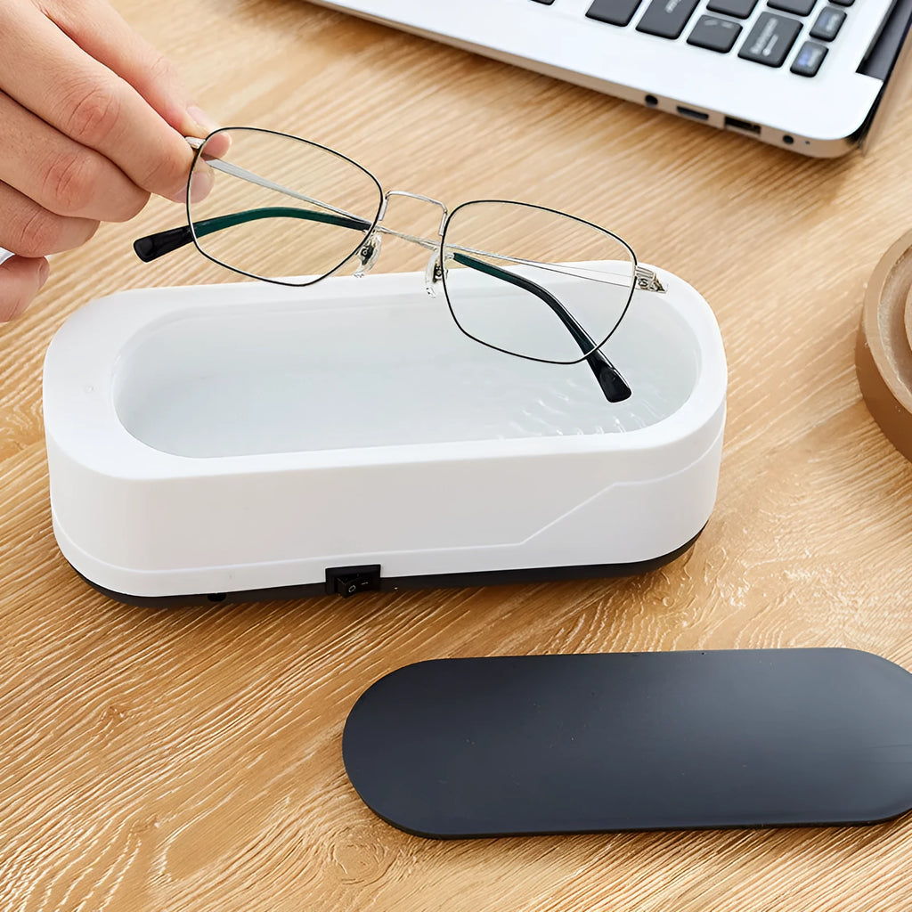Black and white multifunctional ultrasonic cleaner for eyeglasses and jewellery with high frequency vibration