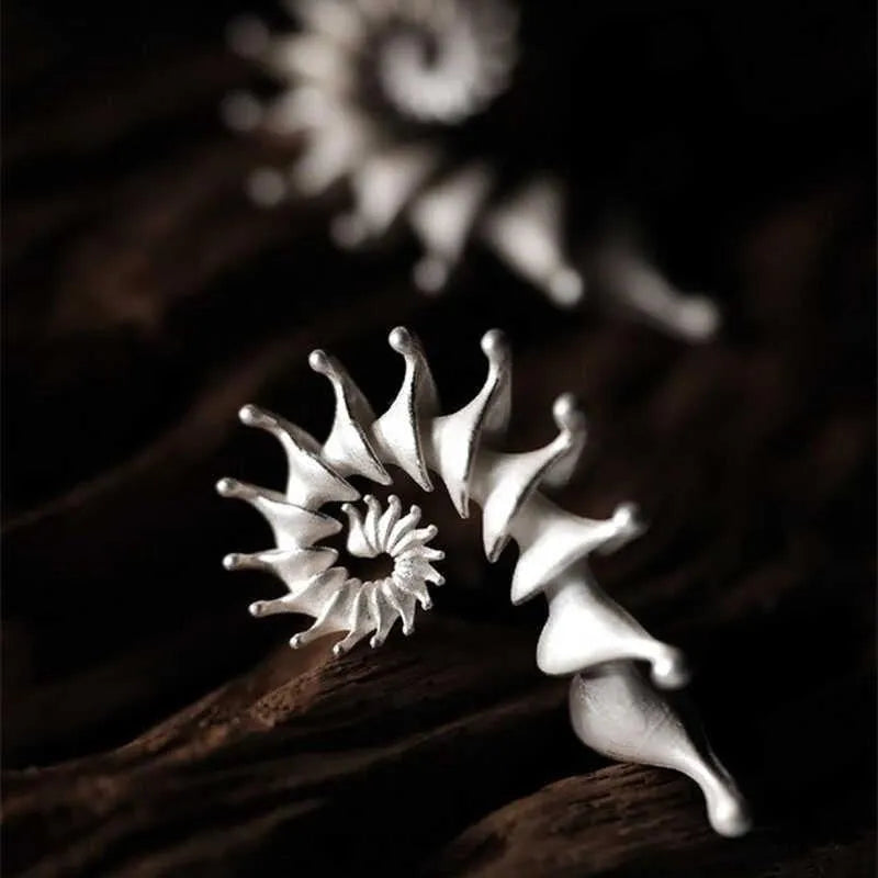 Matte finished conch stud earrings with three-dimensional alloy design