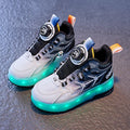 Blue children's roller skates with striped pattern and a rotating button closure on the side.