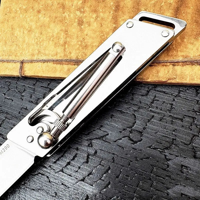 Heavy-duty folding stainless steel utility knife with neutral finish, closed position