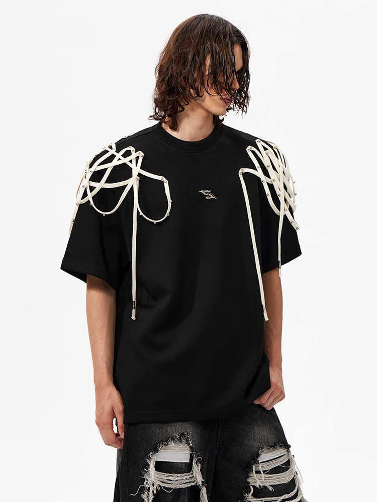 Black short sleeve T-shirt with rivet ribbon padded shoulder detail and loose round neck fit