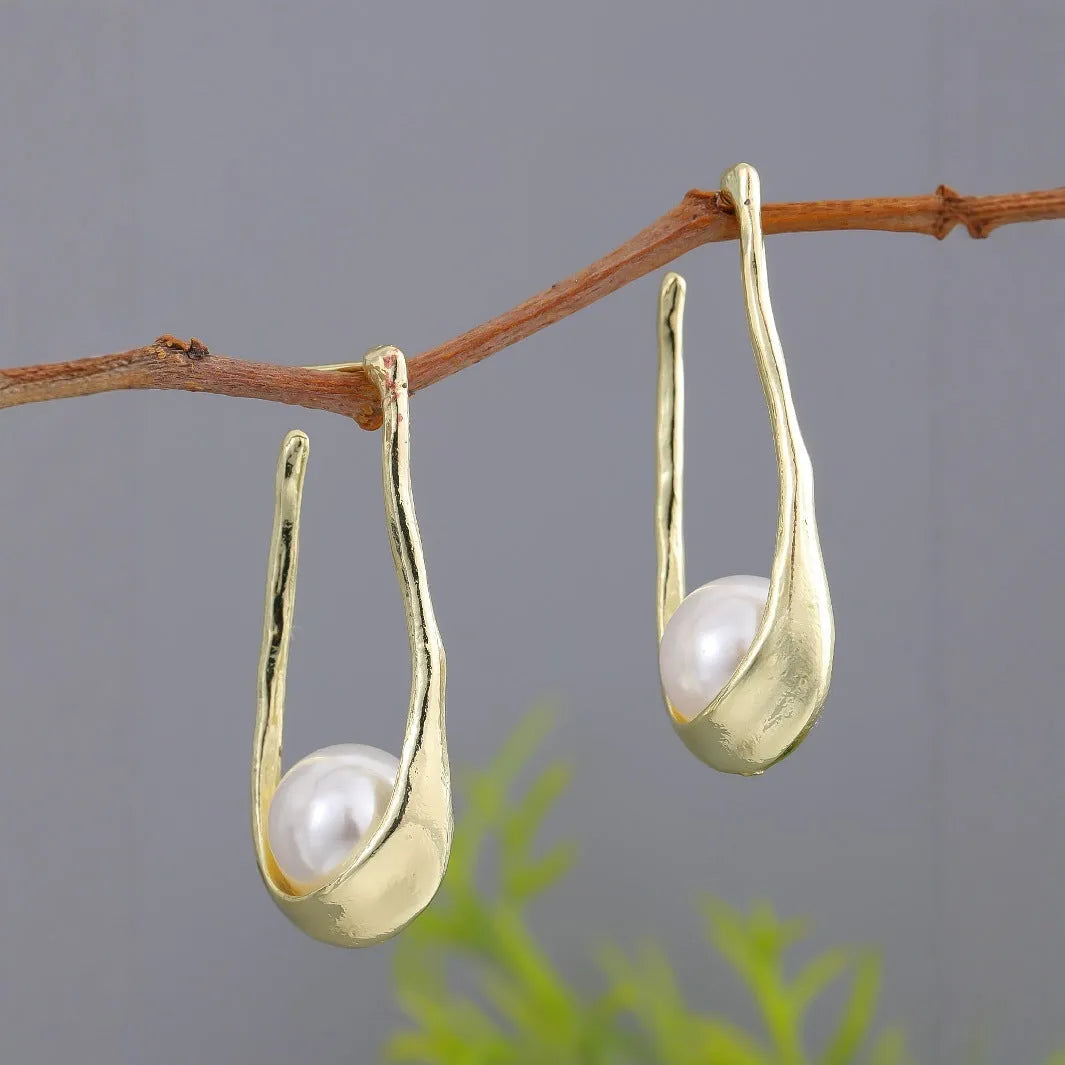 Vintage irregular pearl clip-on earrings in gold colour for women, fashion accessory