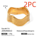 Stainless steel geometric wave pattern ring with wide band and electroplated finish
