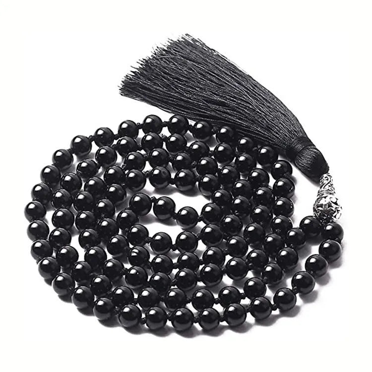 Long geometric agate tassel necklace showing colour options like Indian agate and lapis lazuli on a model.