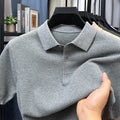 Loose fit grey cotton short sleeve pullover sweater laid flat.
