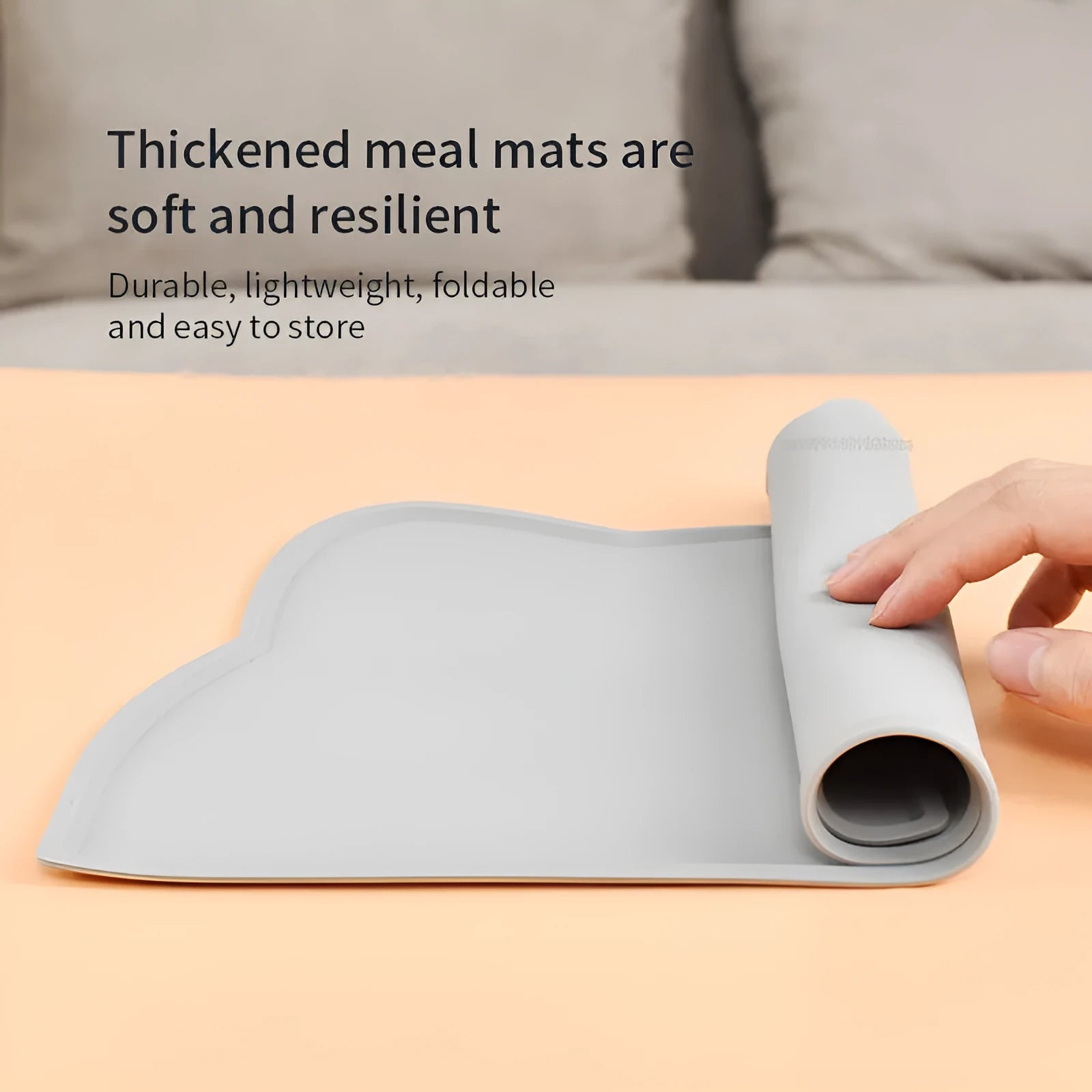 Solid colour silicone pet feeding mat placed under dog bowl on floor
