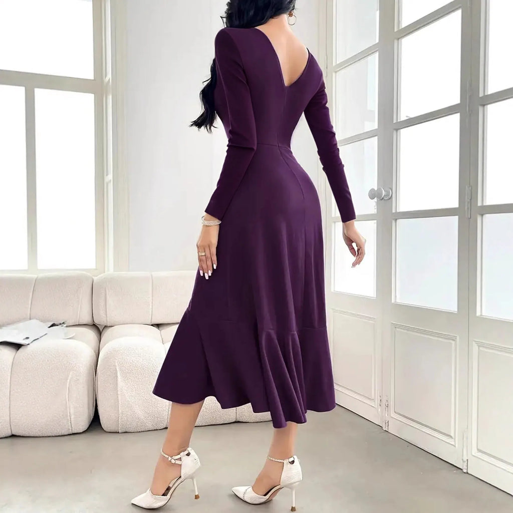 Purple women's long sleeve dress with ruffles and a round neck.