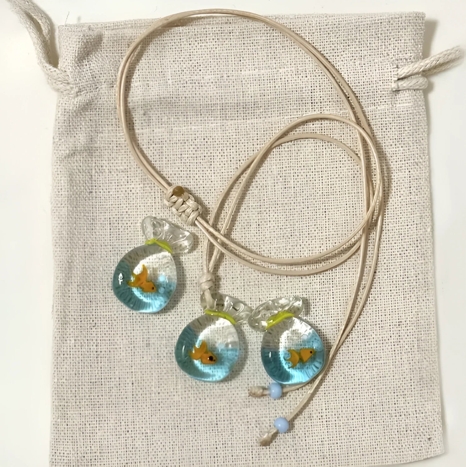 Women's skirt and joker pendant necklace with coloured glaze on cotton linen chain
