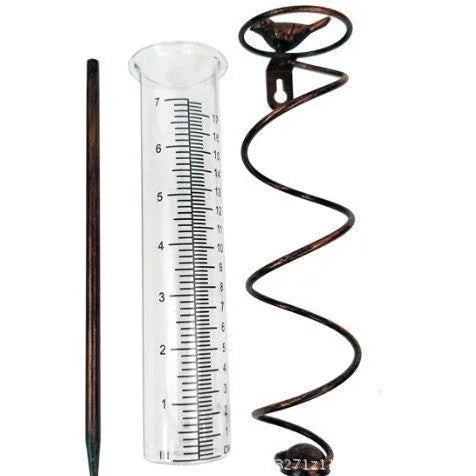 Cast iron bird-shaped outdoor rain gauge with glass measurement tube showing 0-800ml capacity scale.
