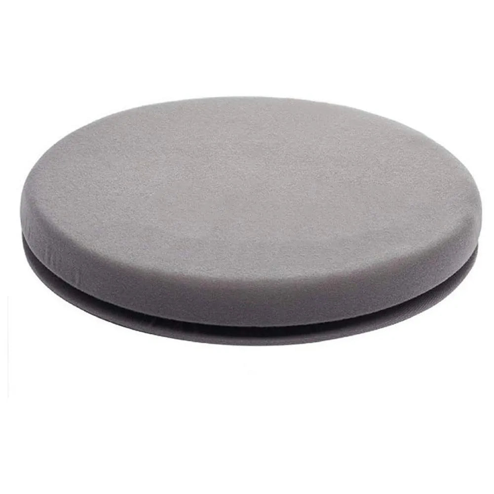 Circular grey rotating car seat cushion for elderly passengers on a car seat