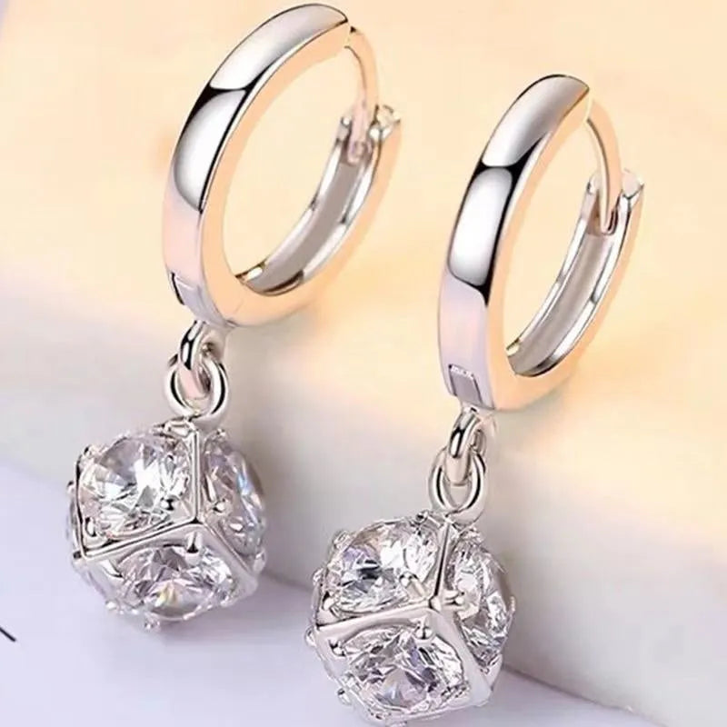 Geometric copper earrings with rose design elements and zircon detail in silver electroplated finish