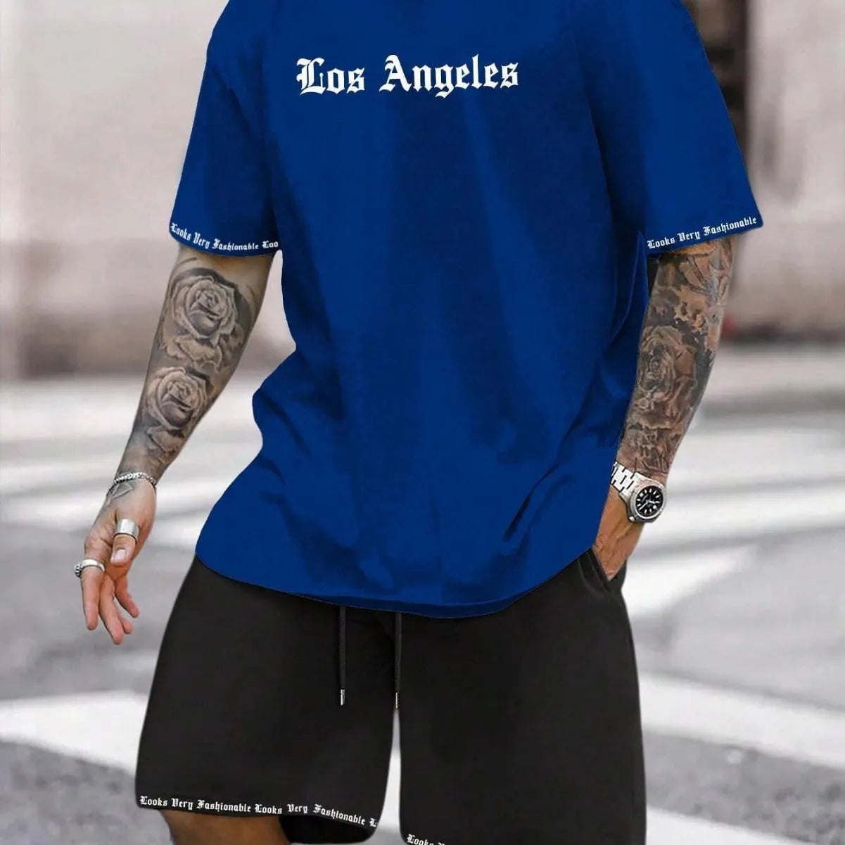 Sports style short-sleeved shirt and matching shorts set in a thin, printed fabric on a mannequin.