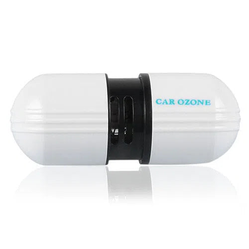 White car air purifier deodorizer 75x30x26mm with 12V plug on a surface