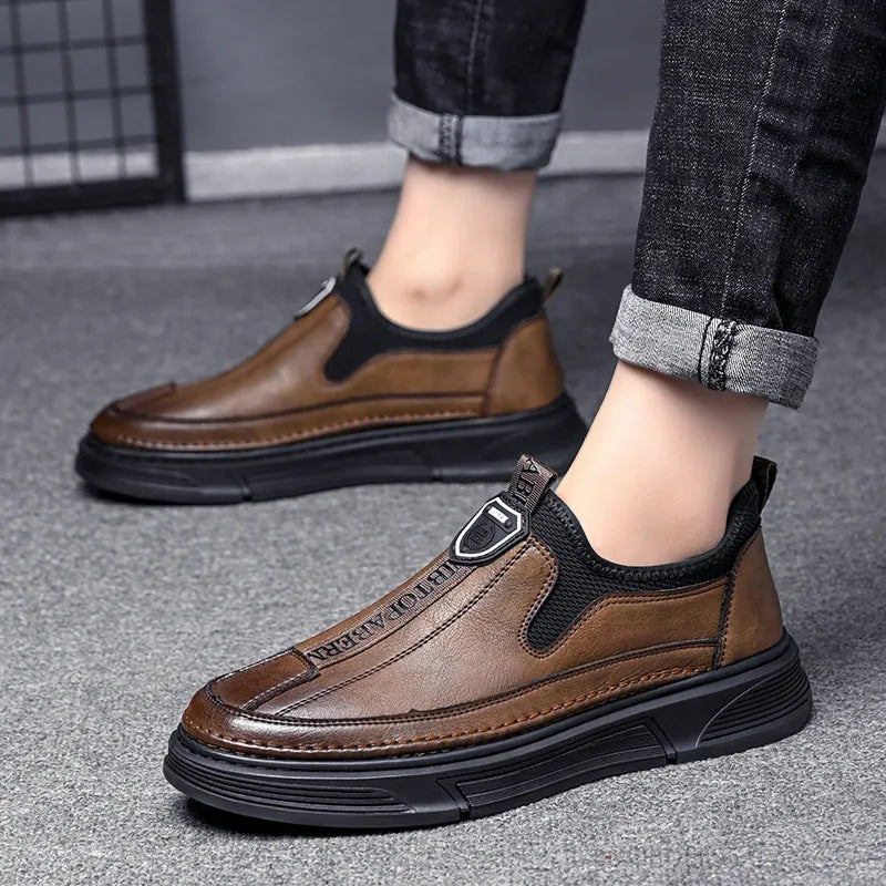 Men's black and brown casual leather shoes with round toe design shown from side view