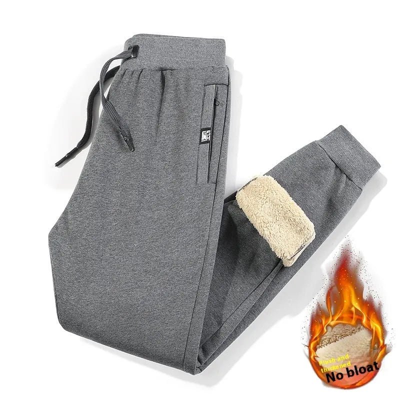 Men's gray fleece-lined oversized track pants with cotton fabric and drawstring waist