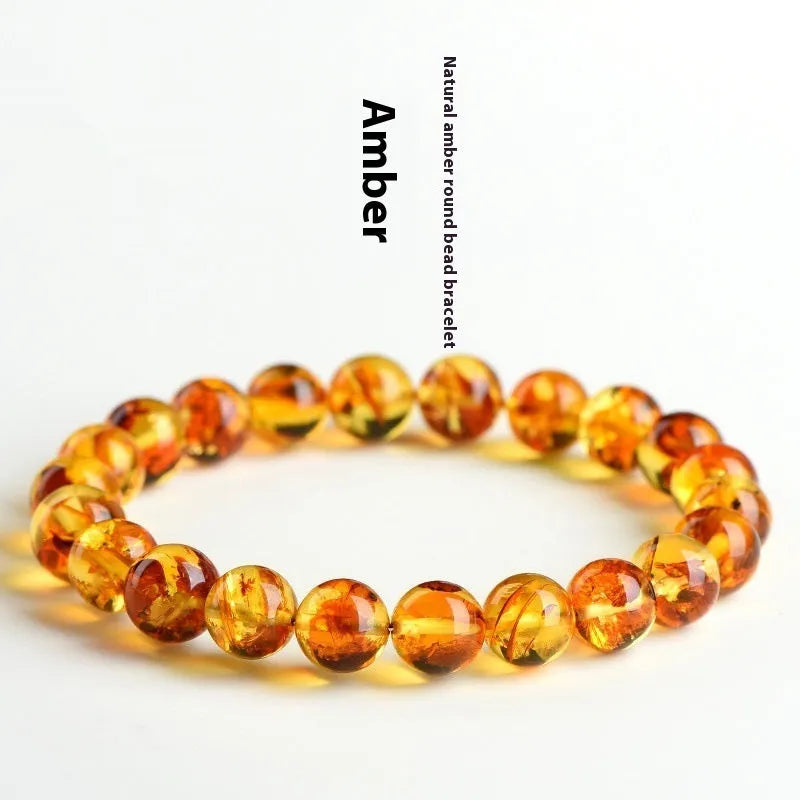 A geometric bead bracelet made from natural yellow piebald amber with flower spot patterning.