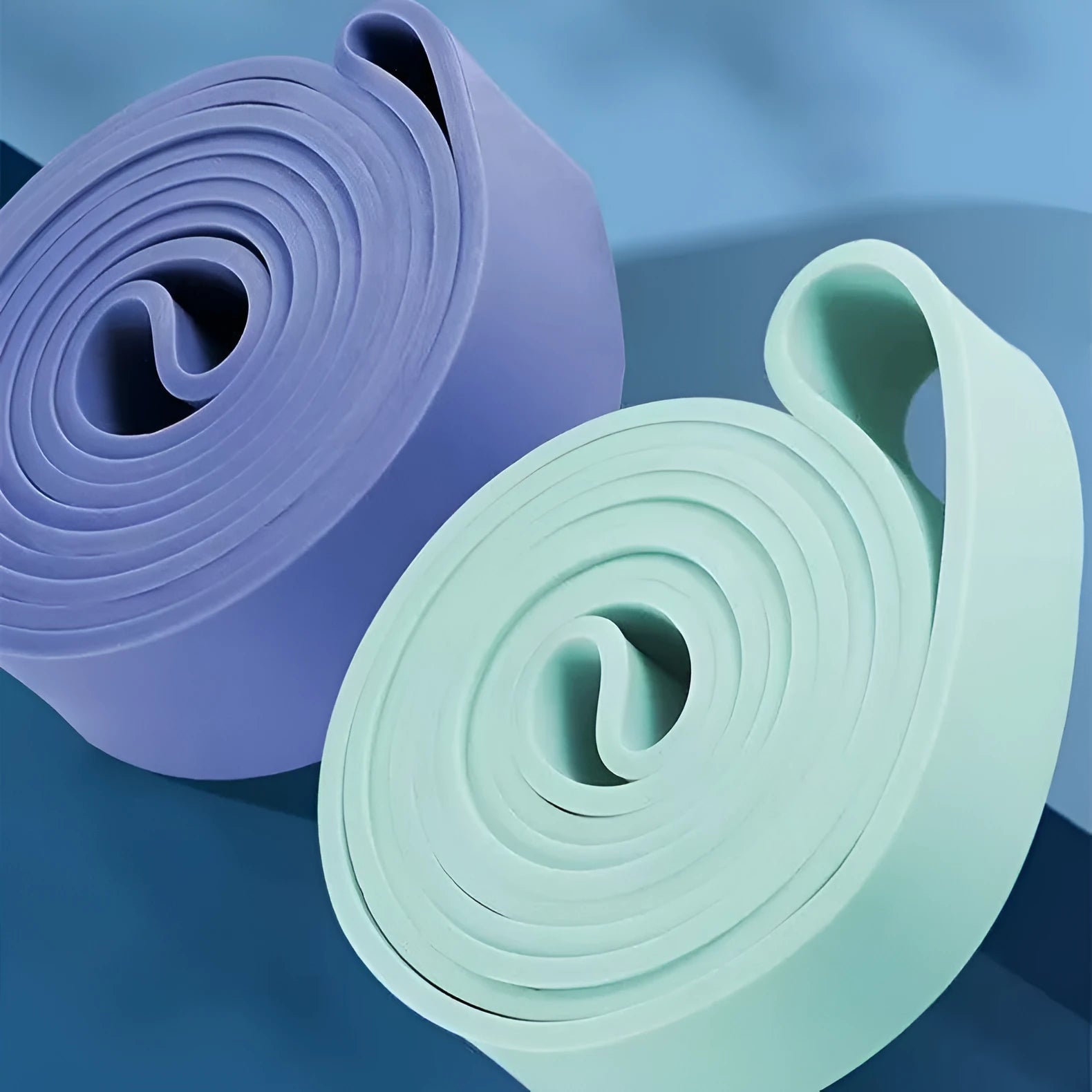 TPR resistance bands in multiple colours laid out showing 2080mm length and varied thicknesses for home exercise