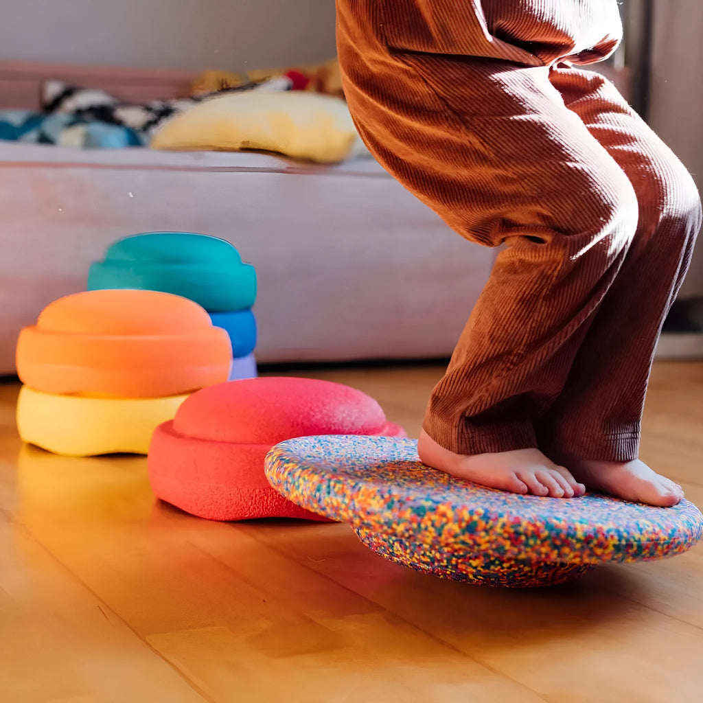 Plastic surf-style balance board with wood-grain finish for children aged 4 to 6 years.