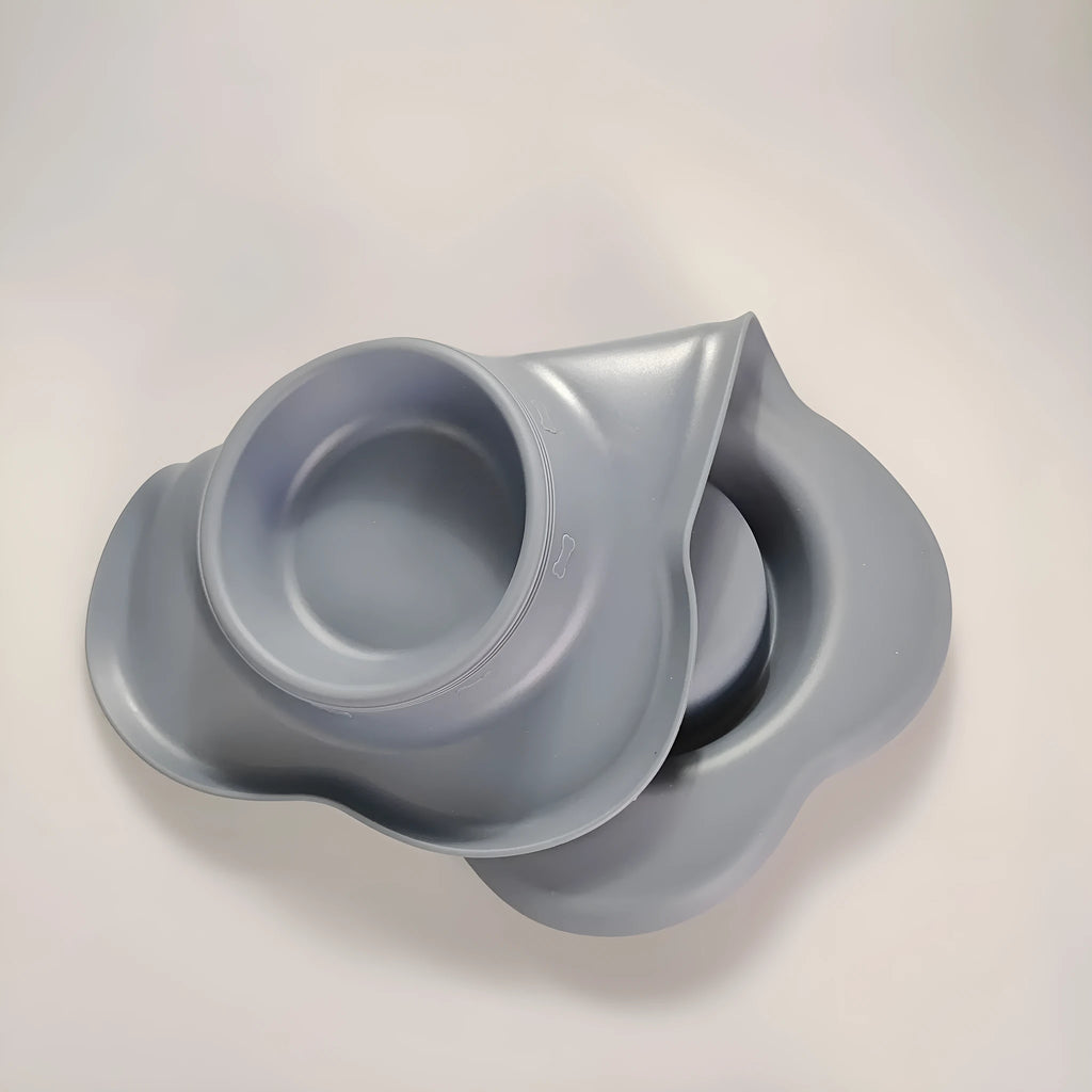 A large silicone double dog bowl with a non-slip base and integrated feeding mat, shown in sky blue colour.