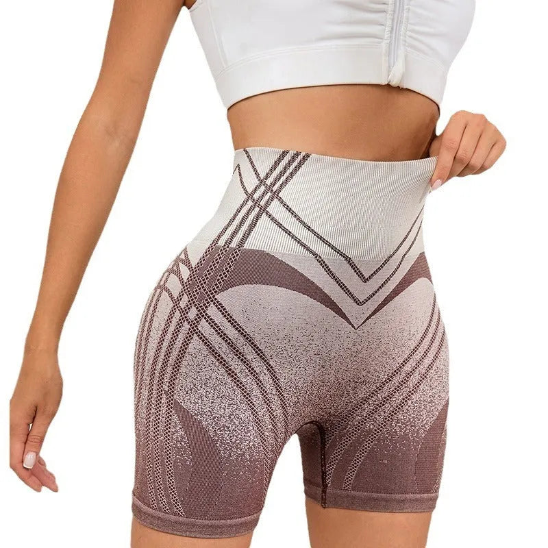 Women's high waisted gradient fitness shorts in black, shown for yoga or running.