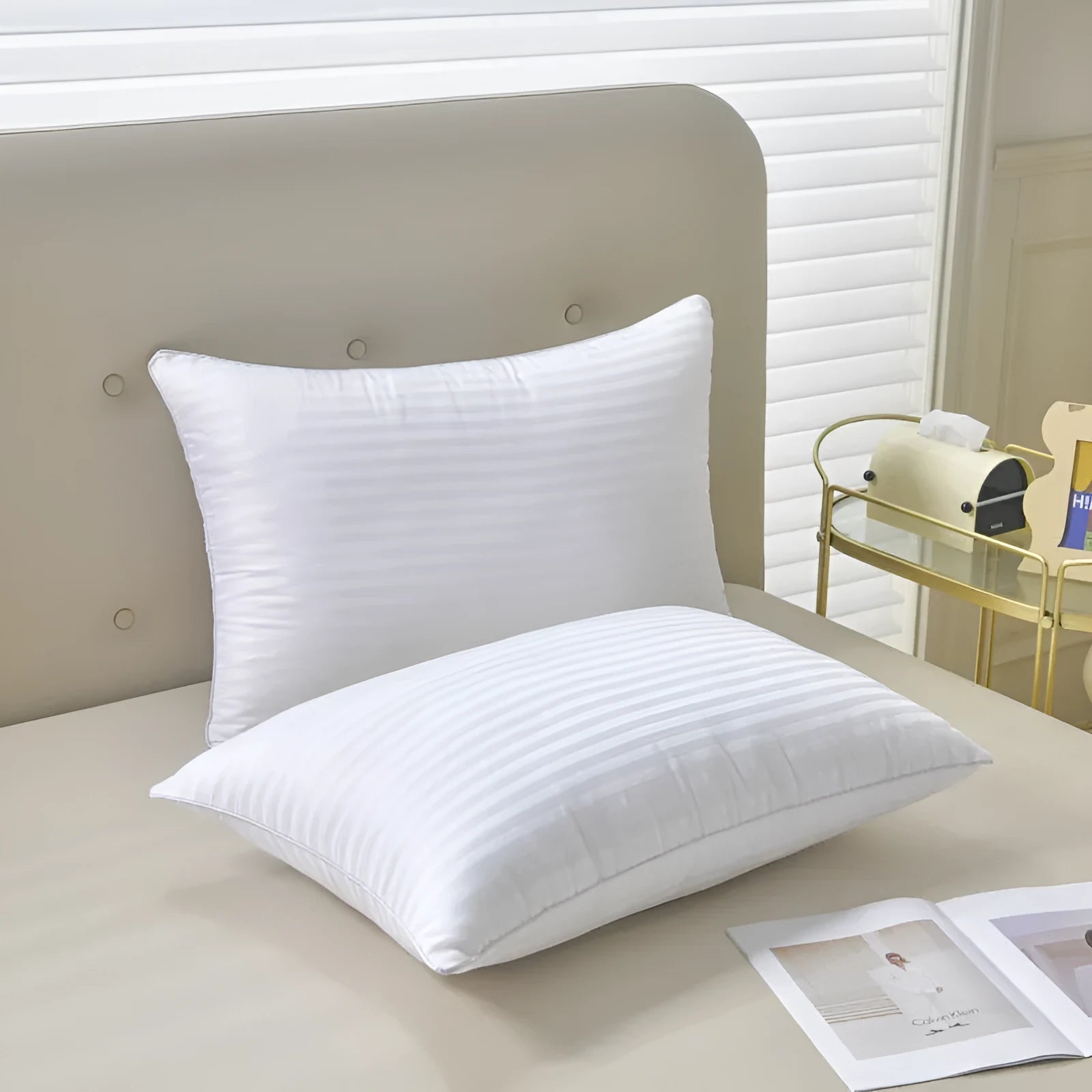 White cotton satin stripe pillow with feather filling in three size options for hotel or home use