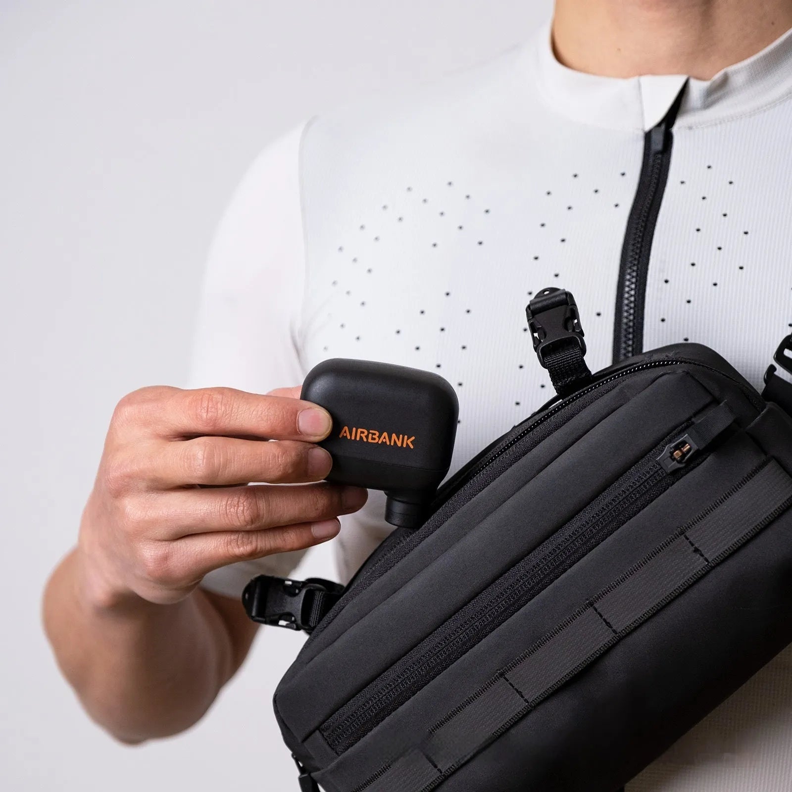 Black mini electric bicycle pump with USB charging cable and waterproof storage bag