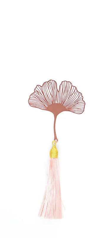 Brass metal bookmark with hollow leaf design and rose gold tassel in a presentation box.