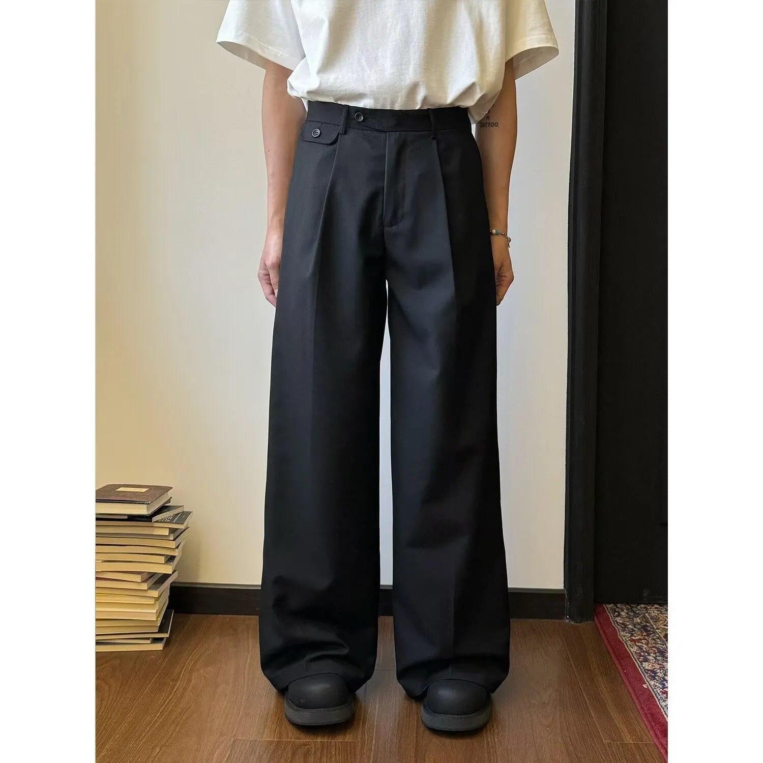 Men's straight-leg casual trousers with loose wide-leg cut and draping design in black or brown