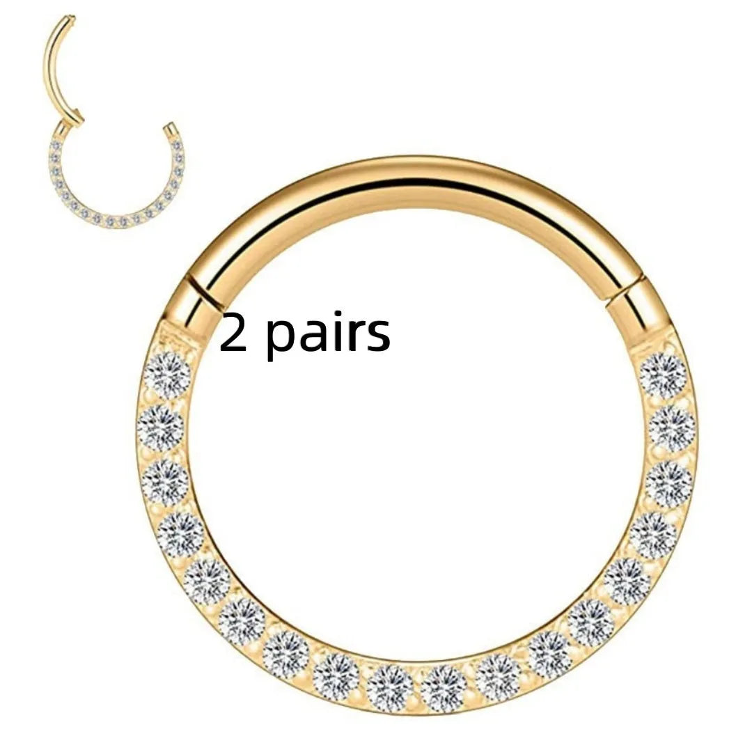 Two pairs of round, seamless 316 stainless steel nose rings showing black, gold, rose gold, and steel colour finishes.